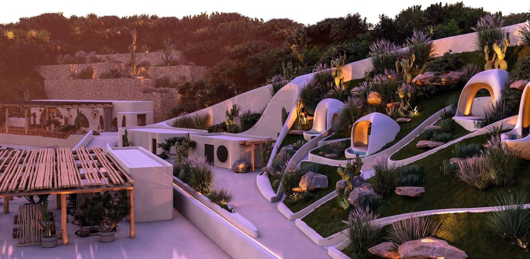 White rounded structures on a planted hillside at dusk