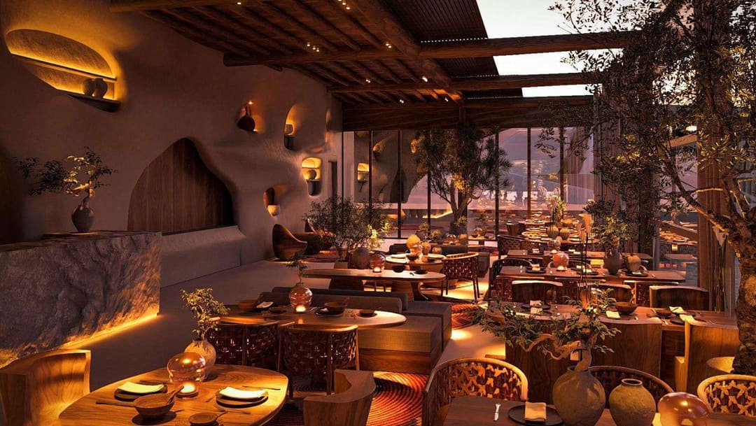 Restaurant with a timber ceiling, olive trees and a view through glass