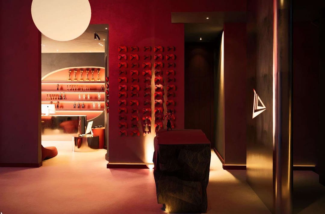 Shop in red tones with wall shelves and figurines